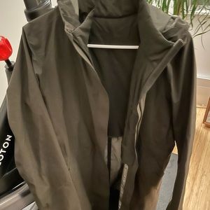 Lululemon olive rain jacket. Hood, full zipper, pockets and partial lining.